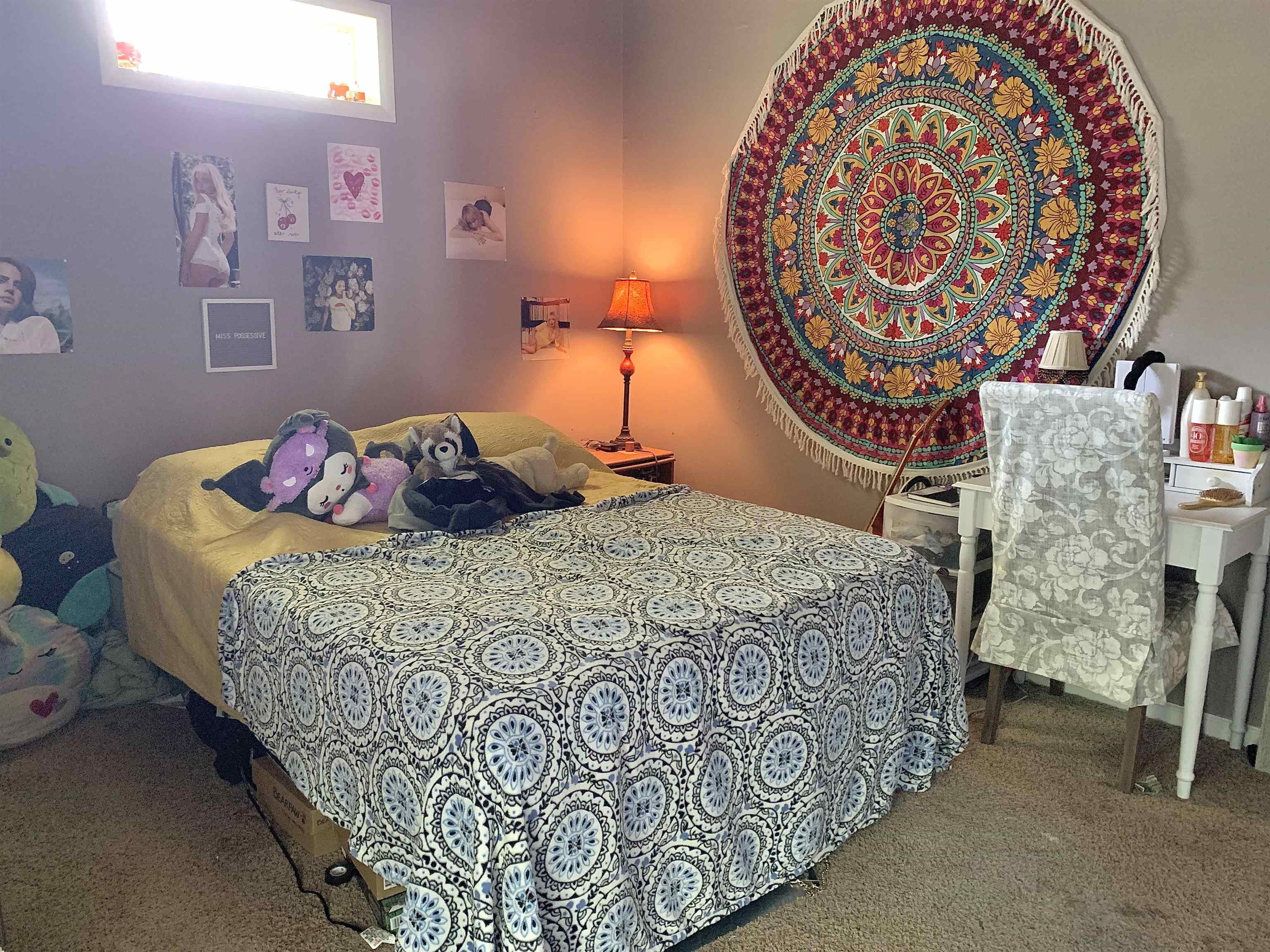 7675 Peavine Road Middleton, TN 38052 - Photo 19 of 26 a bedroom with a bed and a lamp on dresser