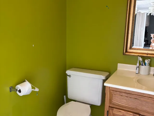a bathroom with a toilet and sink