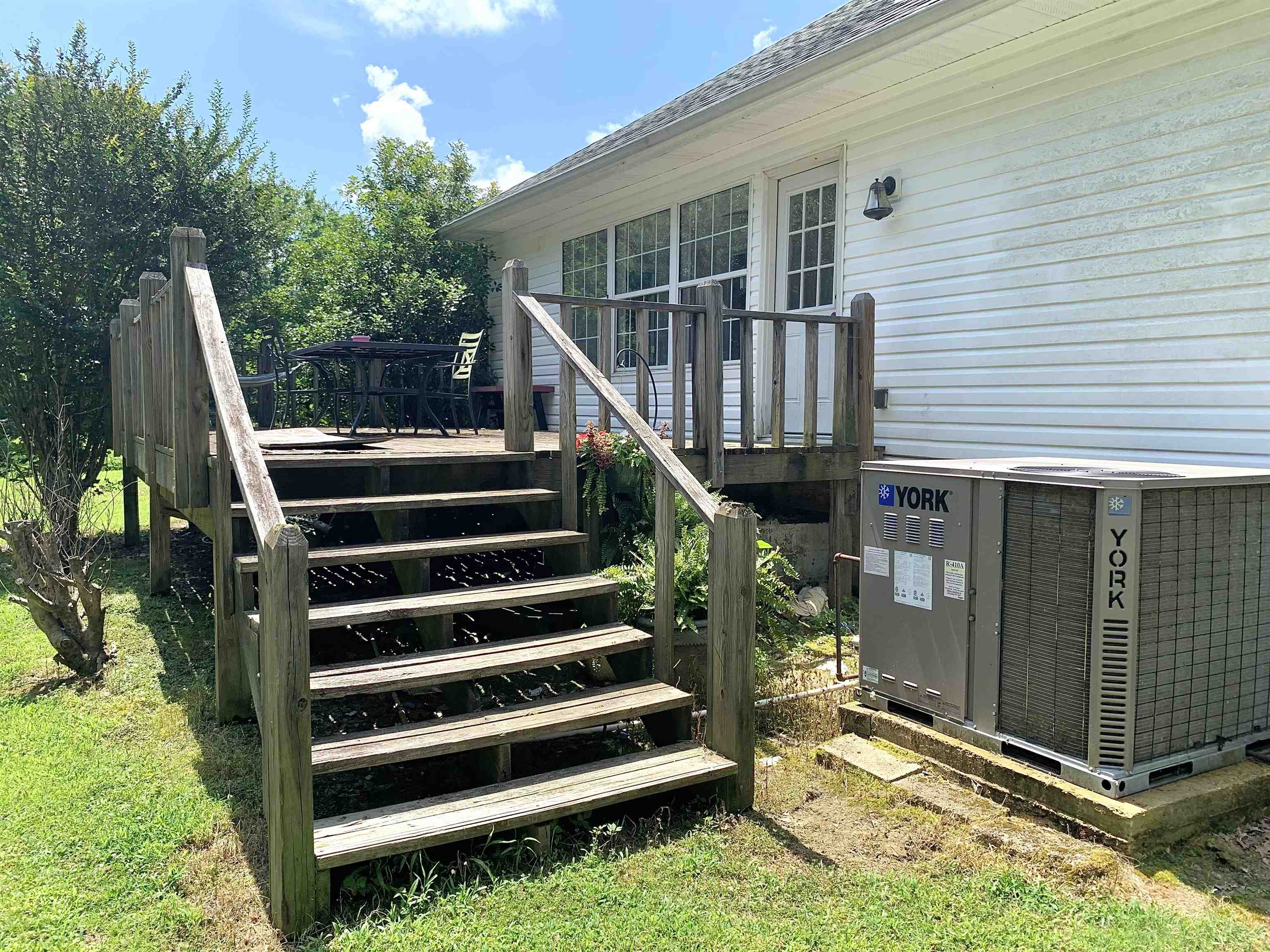 7675 Peavine Road Middleton, TN 38052 - Photo 4 of 26 a view of a house with a large window and wooden fence