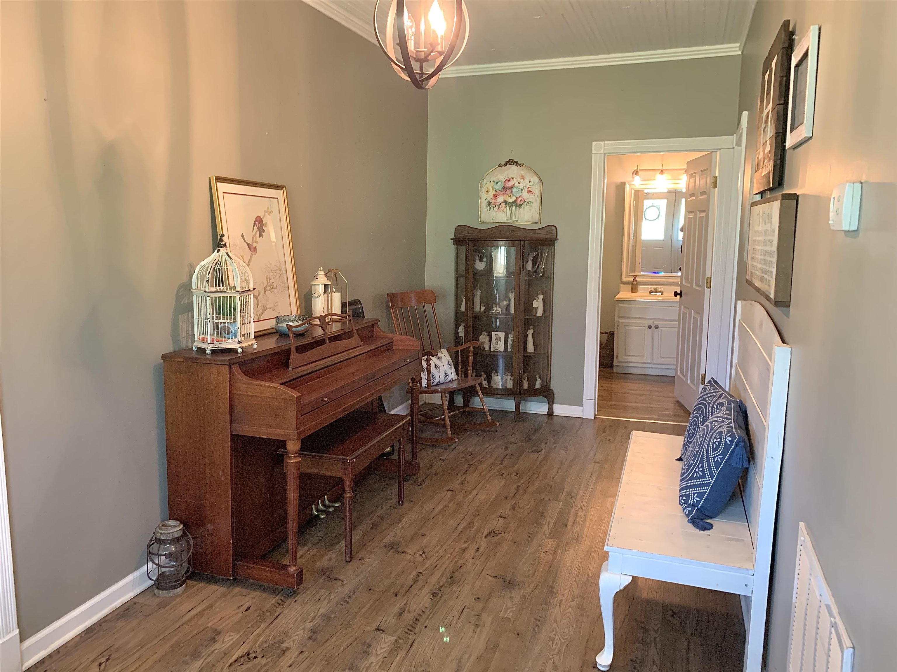 7675 Peavine Road Middleton, TN 38052 - Photo 5 of 26 a room with furniture and a chandelier