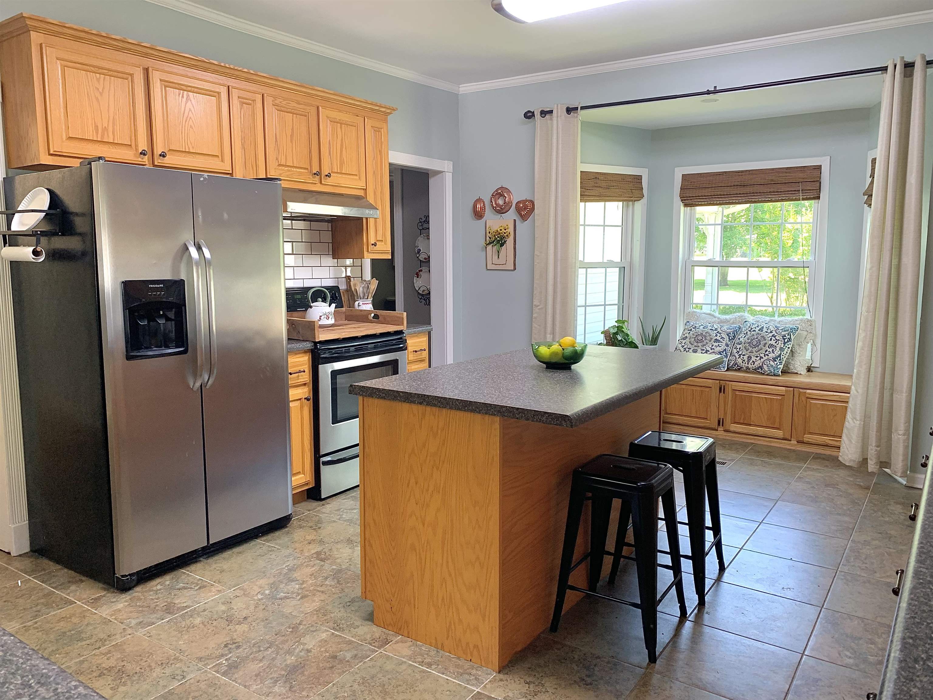 7675 Peavine Road Middleton, TN 38052 - Photo 9 of 26 a kitchen with stainless steel appliances granite countertop a refrigerator a stove and a more cabinets