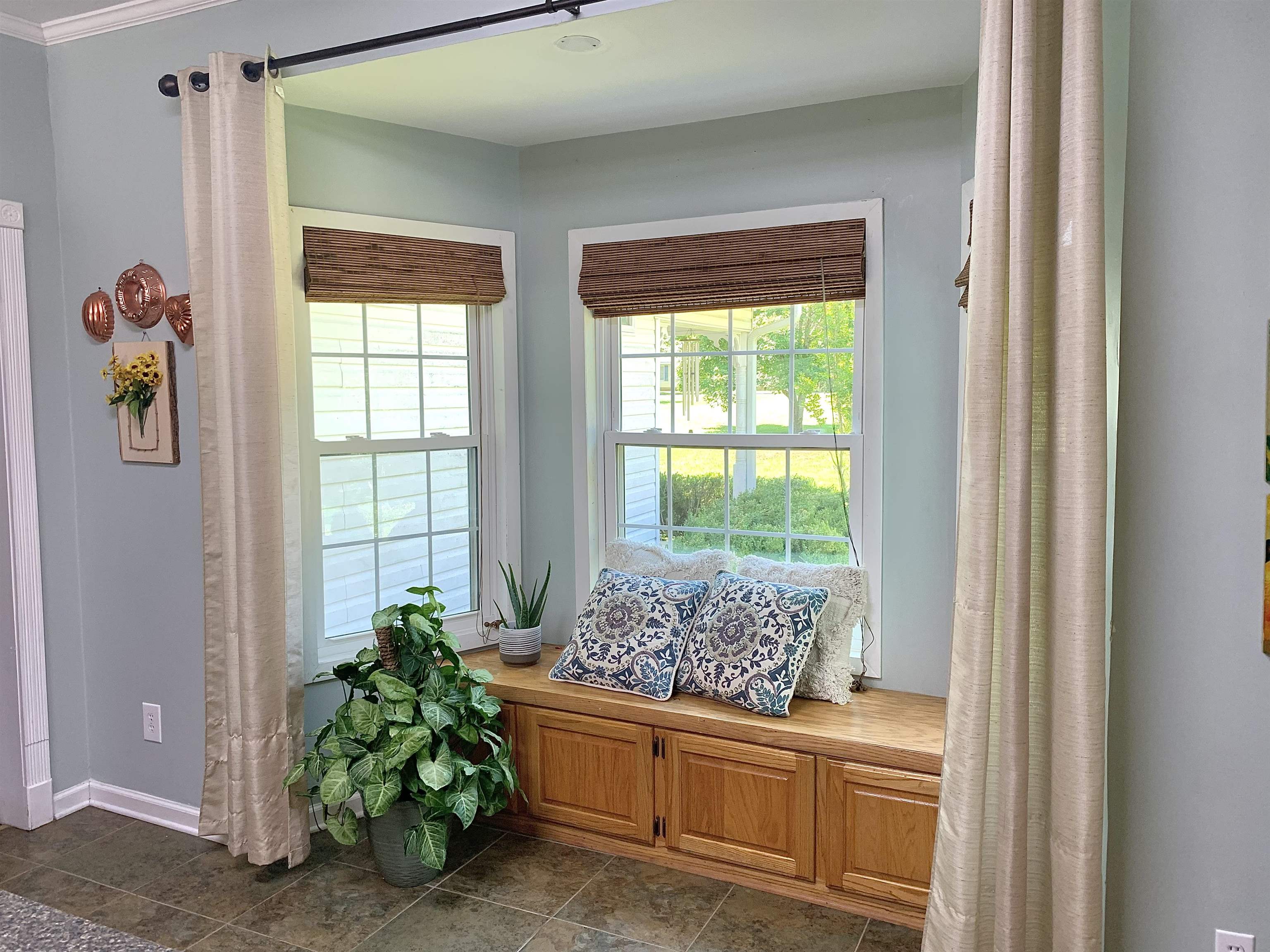 7675 Peavine Road Middleton, TN 38052 - Photo 10 of 26 a living room with a large window and potted plant