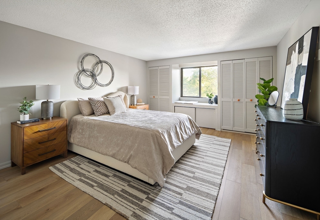 43 Pomeworth Street, Unit 44 Stoneham, MA 02180 - Photo 12 of 15 a spacious bedroom with a bed and a window