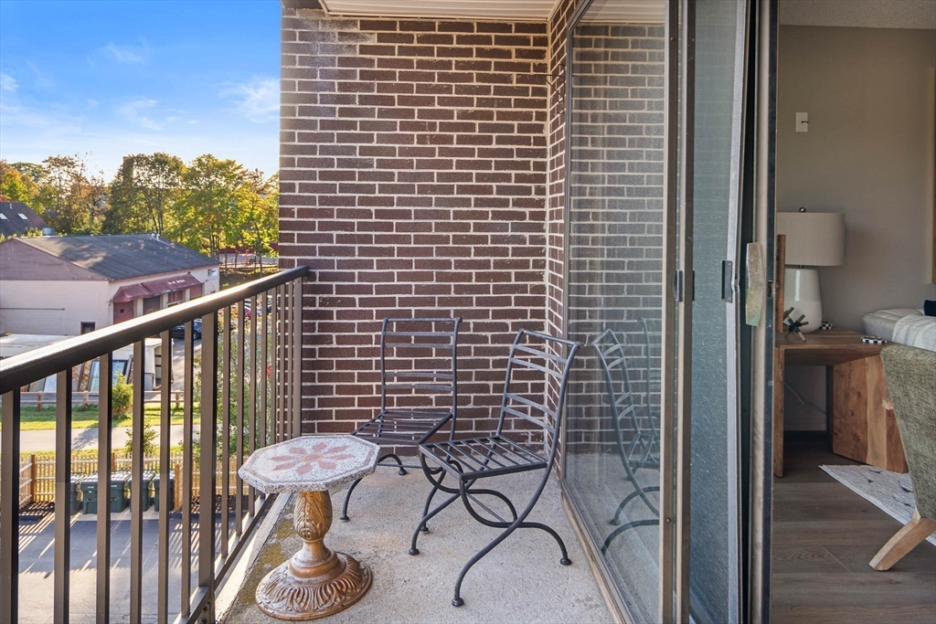 43 Pomeworth Street, Unit 44 Stoneham, MA 02180 - Photo 10 of 15 a view of a balcony with furniture