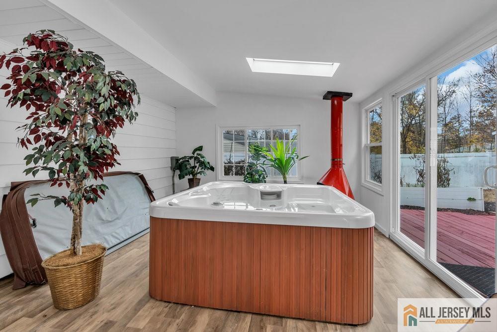 36 New Road Kendall Park, NJ 08824 - Photo 11 of 30 a dining table with a potted plant sitting next to a window