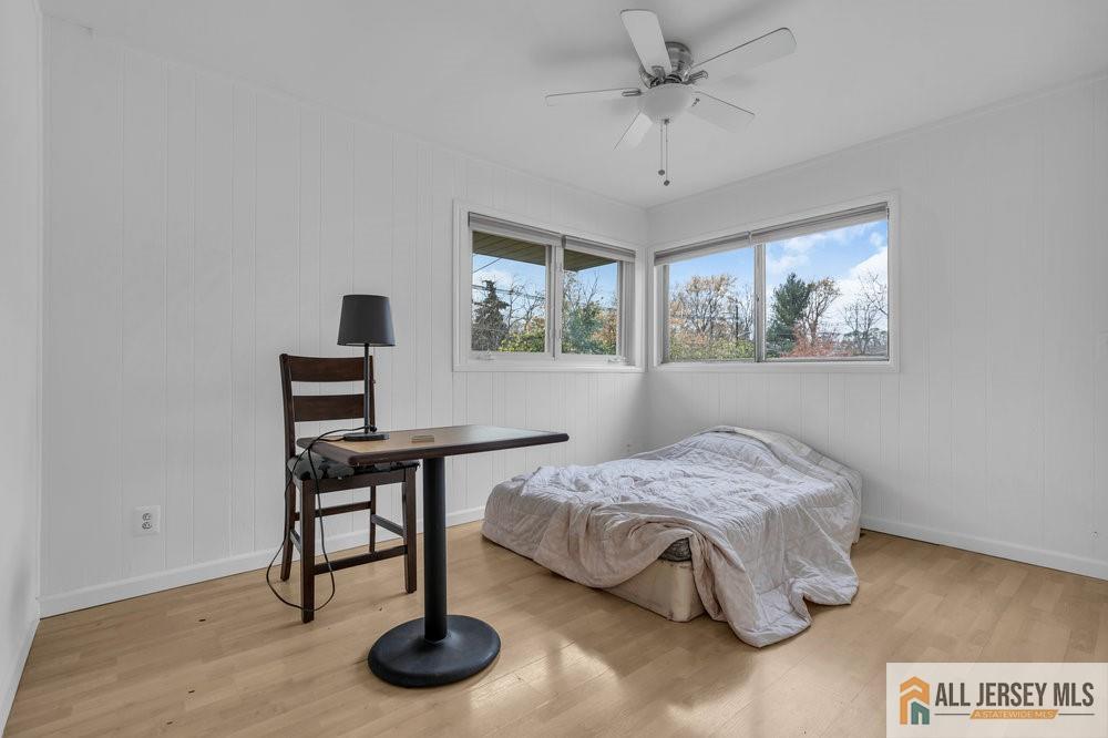 36 New Road Kendall Park, NJ 08824 - Photo 14 of 30 a bedroom with a bed and a table