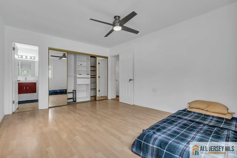 36 New Road Kendall Park, NJ 08824 - Photo 18 of 30 a bedroom with a bed and cabinets