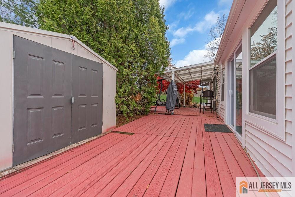 36 New Road Kendall Park, NJ 08824 - Photo 22 of 30 a view of a wooden deck
