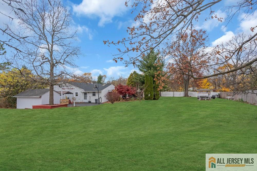 36 New Road Kendall Park, NJ 08824 - Photo 25 of 30 a view of a house with a big yard