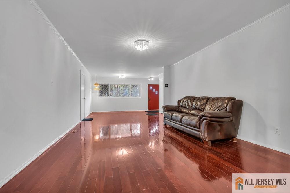 36 New Road Kendall Park, NJ 08824 - Photo 4 of 30 a living room with hard wood floors and a couch