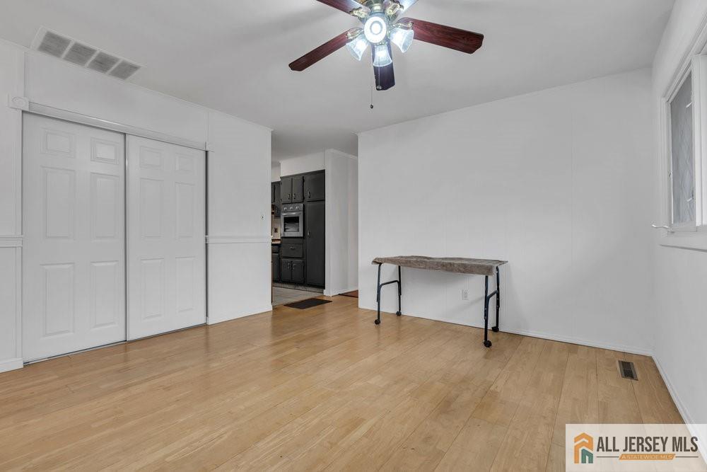 36 New Road Kendall Park, NJ 08824 - Photo 7 of 30 a view of an empty room with a ceiling fan