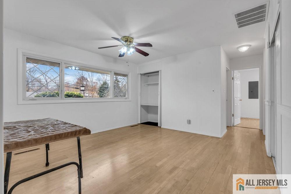 36 New Road Kendall Park, NJ 08824 - Photo 8 of 30 a view of workspace with wooden floor and cabinet