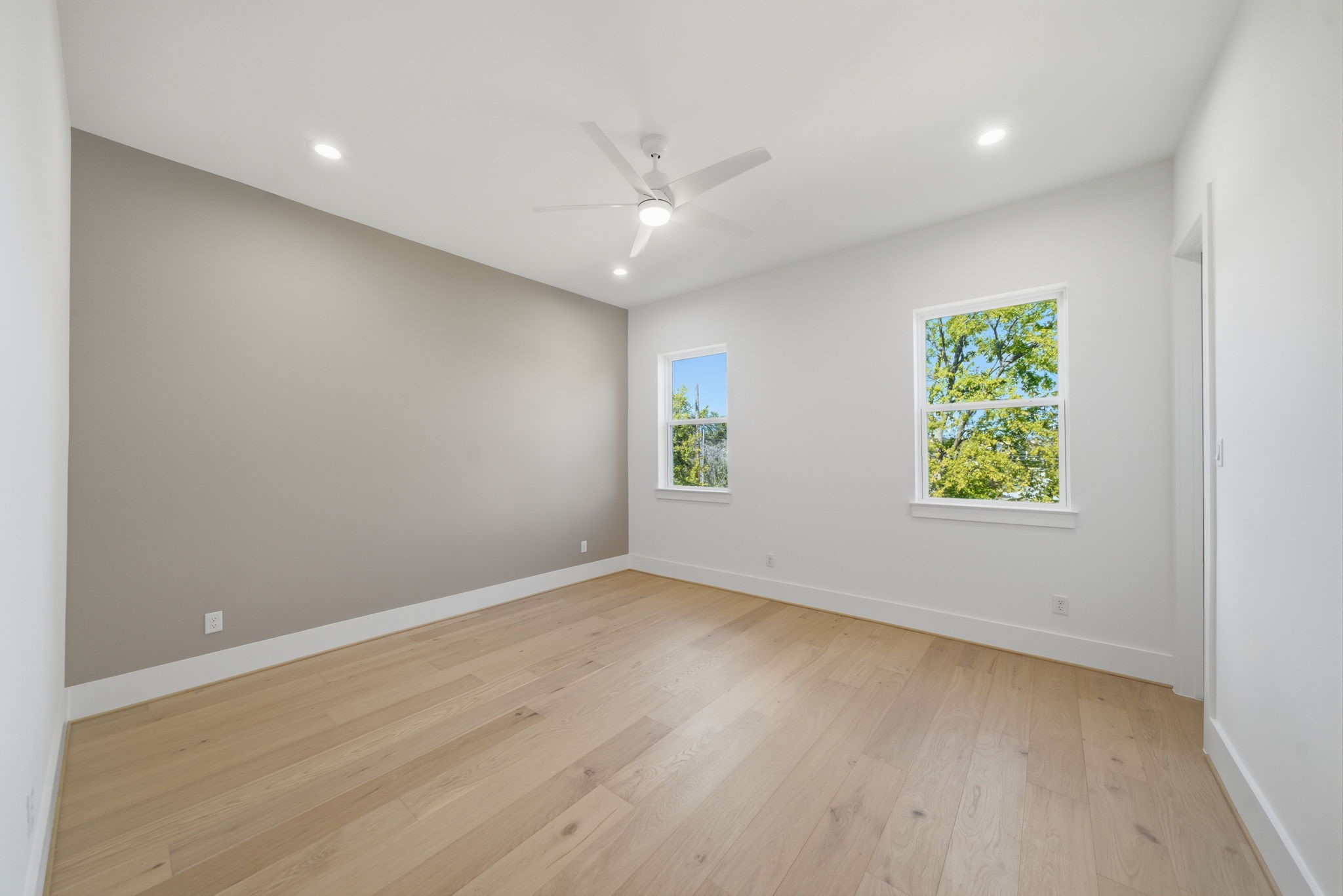 1227 Prince Street Houston, TX 77008 - Photo 15 of 35 wooden floor in an empty room with a window