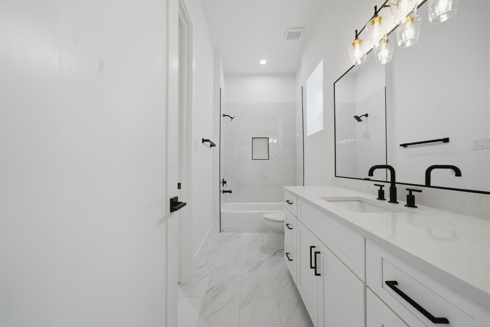 1227 Prince Street Houston, TX 77008 - Photo 24 of 35 a spacious bathroom with a double vanity sink double mirror and bathtub