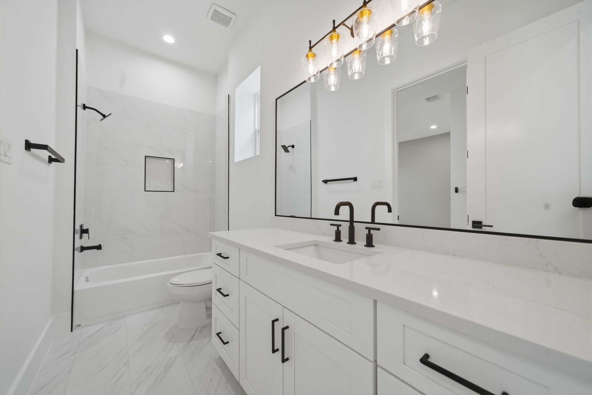 1227 Prince Street Houston, TX 77008 - Photo 25 of 35 a bathroom with a bathtub shower sink vanity and mirror