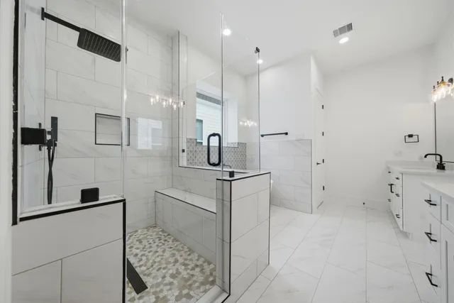 a bathroom with a sink and mirror