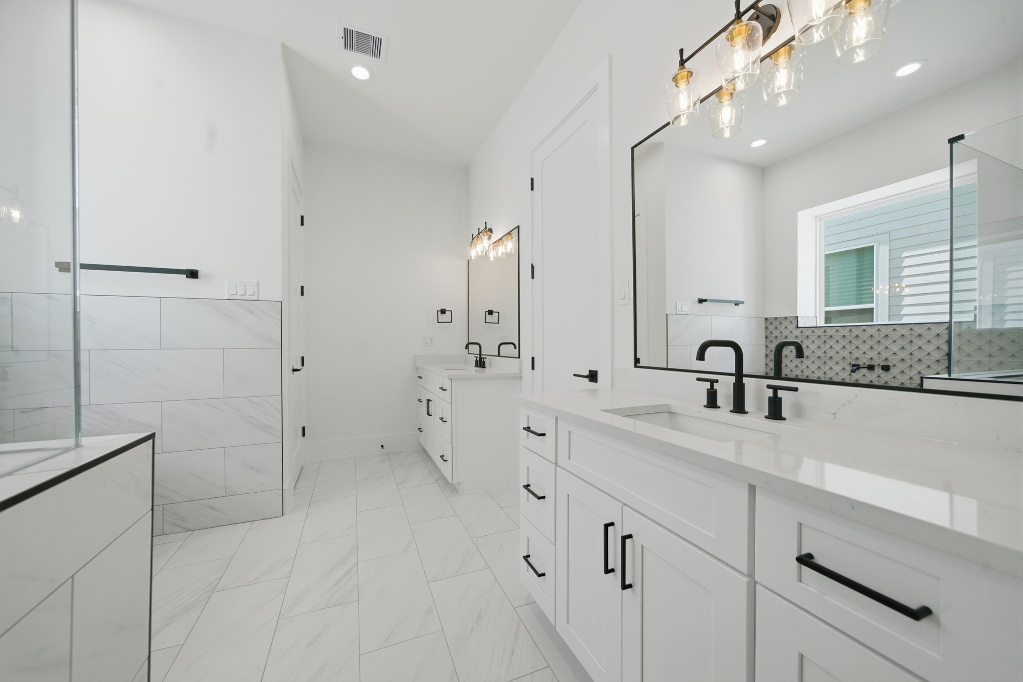 1227 Prince Street Houston, TX 77008 - Photo 31 of 35 a large white bathroom with a double vanity sink a mirror and shower