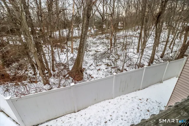 a view of wooden fence in front of house