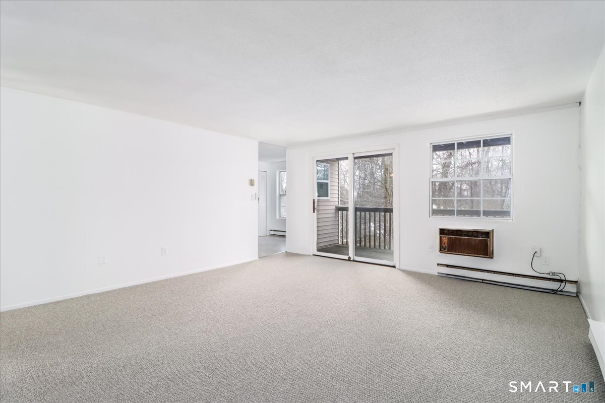 40 Heather Ridge Shelton, CT 06484 - Photo 7 of 28 Spacious Living room with sliders to private deck