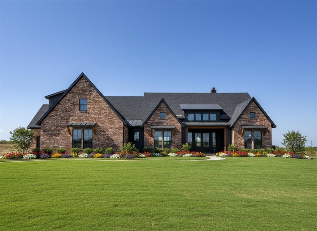 a front view of a house with a garden