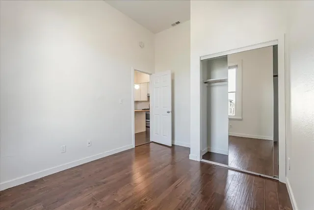 wooden floor & wooden door in an empty room