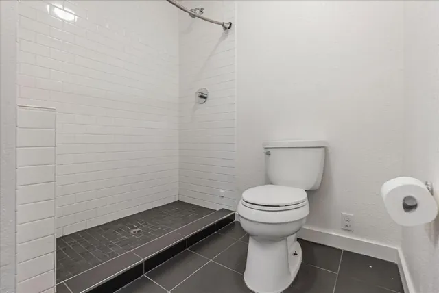 a bathroom with a toilet and a sink