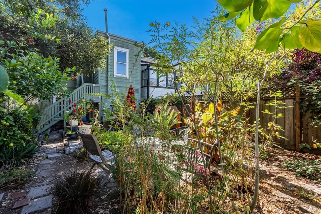 a view of a house with a tree