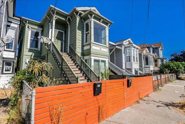 a view of a house with large trees