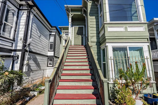 a view of a house with entryway and wooden floor