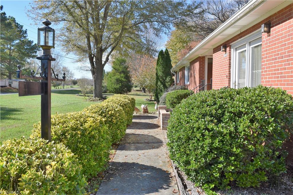 7936 Lester Road Stokesdale, NC 27357 - Photo 2 of 30 Walkway to front entrance