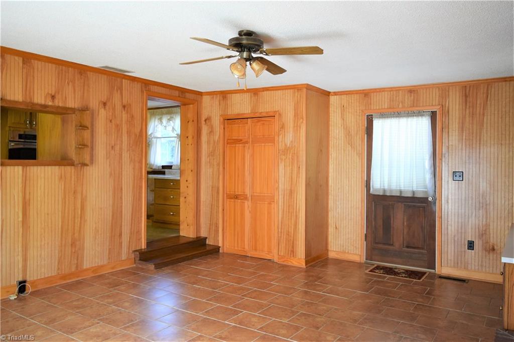 7936 Lester Road Stokesdale, NC 27357 - Photo 11 of 30 Additional view of den with door to kitchen