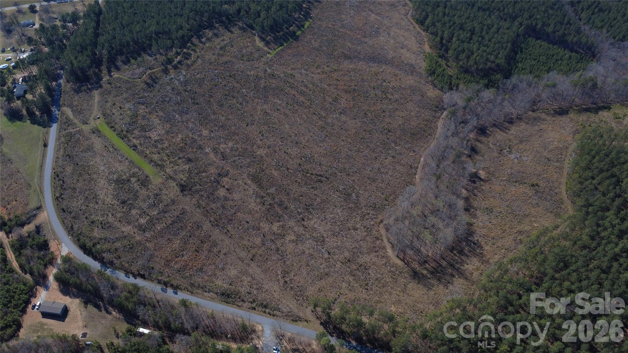 0 Peter Hawk Creek Road, Unit 10 Jonesville, SC 29353 - Photo 21 of 25 a view of a dry yard with wooden fence