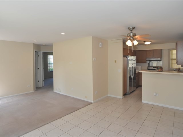 994 Ridgefield Lane, Unit 994 Wheeling, IL 60090 - Photo 4 of 19 a view of a kitchen with a sink