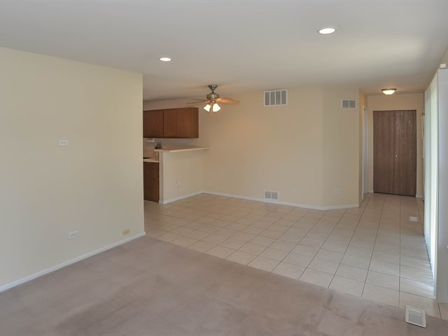 994 Ridgefield Lane, Unit 994 Wheeling, IL 60090 - Photo 6 of 19 an empty room with a empty space