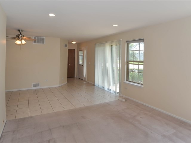 994 Ridgefield Lane, Unit 994 Wheeling, IL 60090 - Photo 8 of 19 a view of an empty room with a window