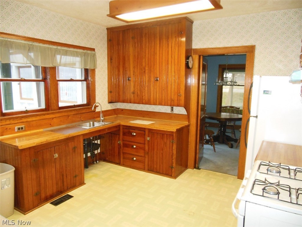 6333 North Ridge Road West Geneva, OH 44041 - Photo 7 of 19 Kitchen includes the Range & Refrigerator