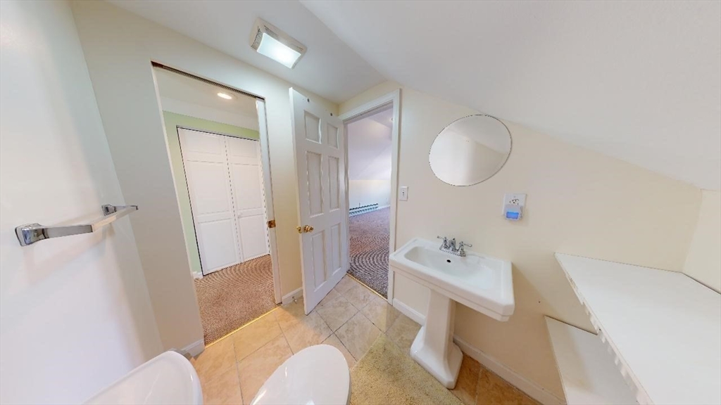 17 Gorham Road, Unit 2 Medford, MA 02155 - Photo 27 of 37 a bathroom with a sink a toilet and shower