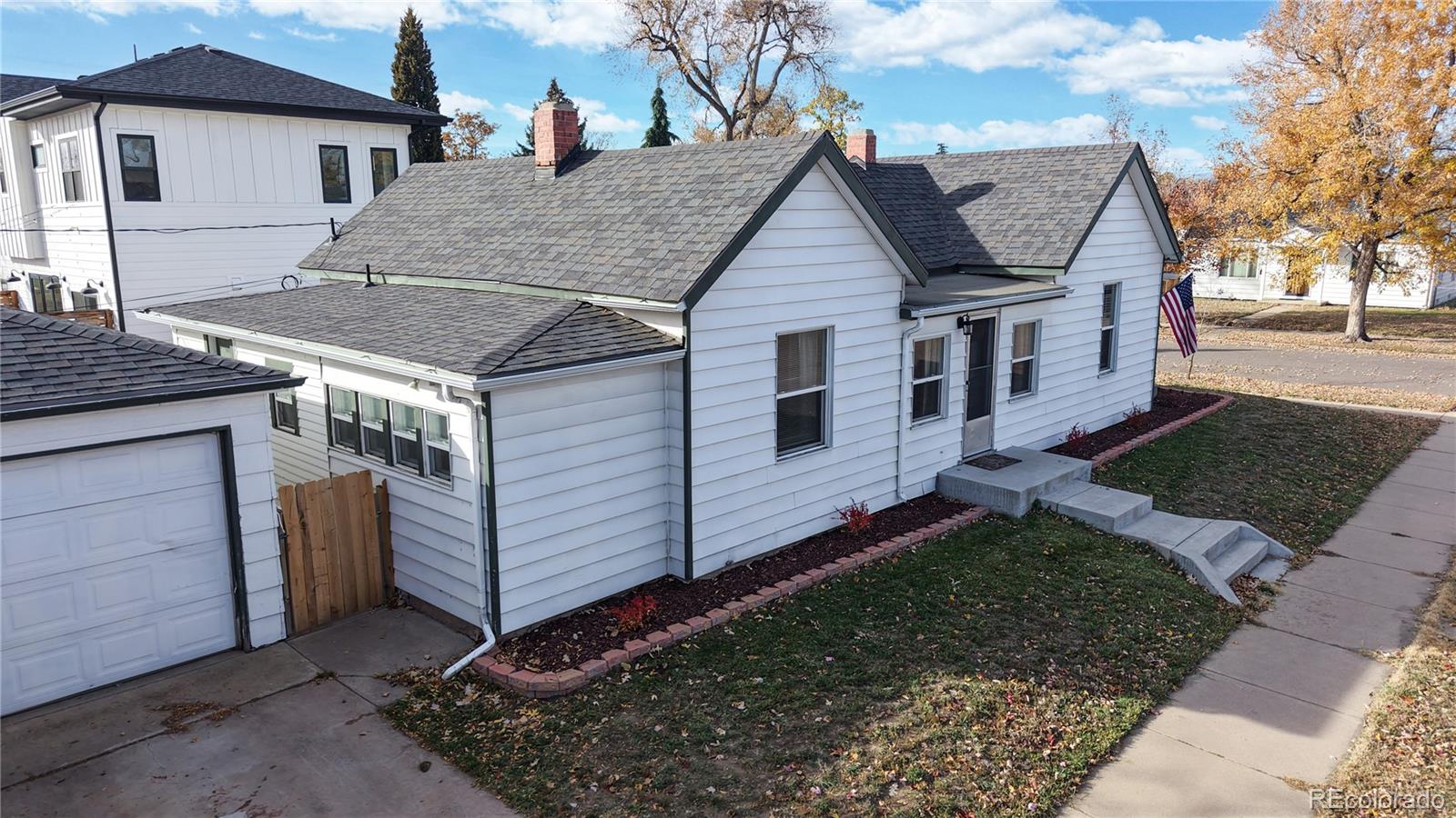 4890 Irving Street Denver, CO 80221 - Photo 26 of 35 a view of a house with a yard
