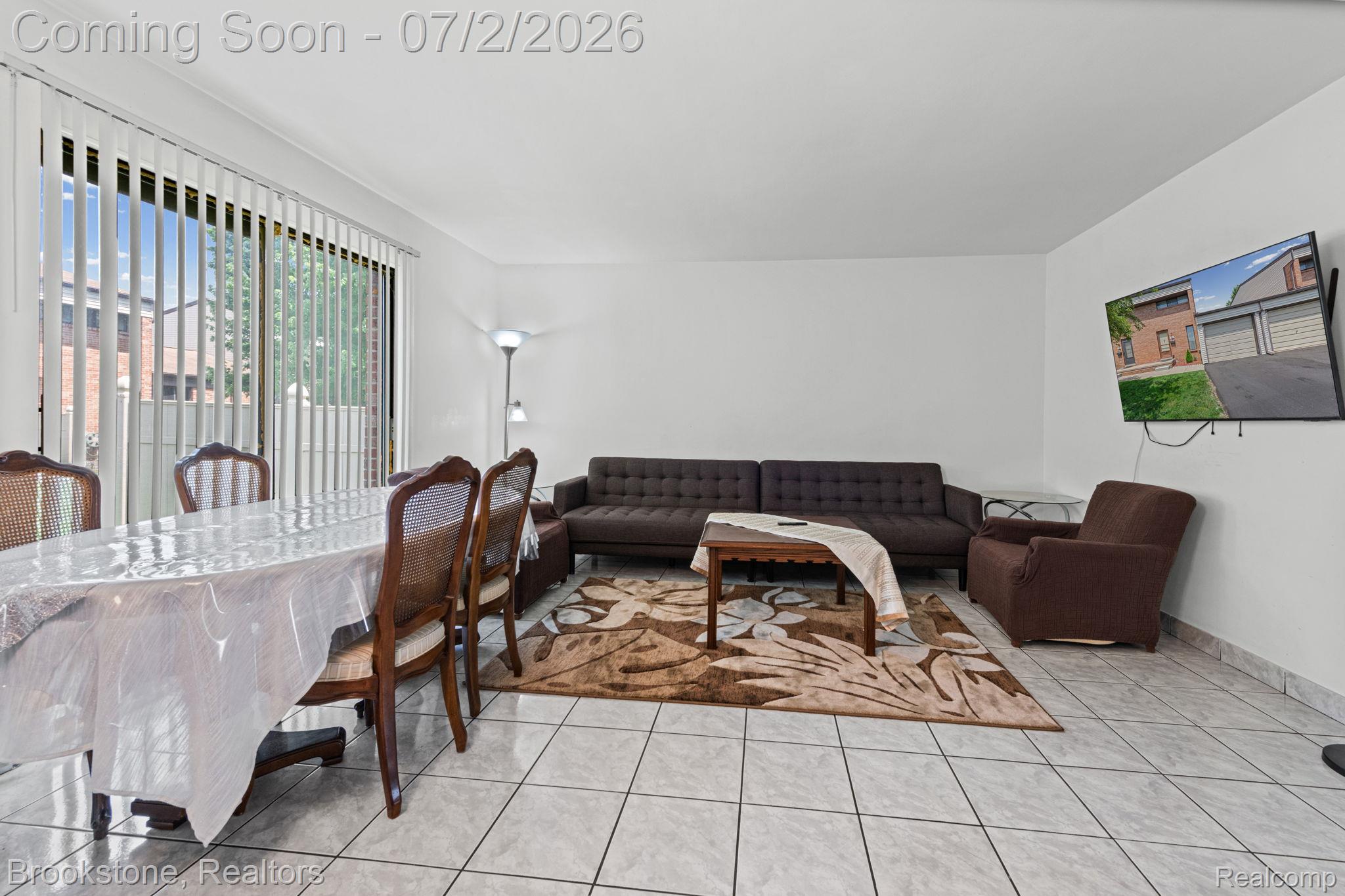 1925 Nicholas Court Warren, MI 48092 - Photo 13 of 26 Open-concept living space with light-toned tile flooring and white walls