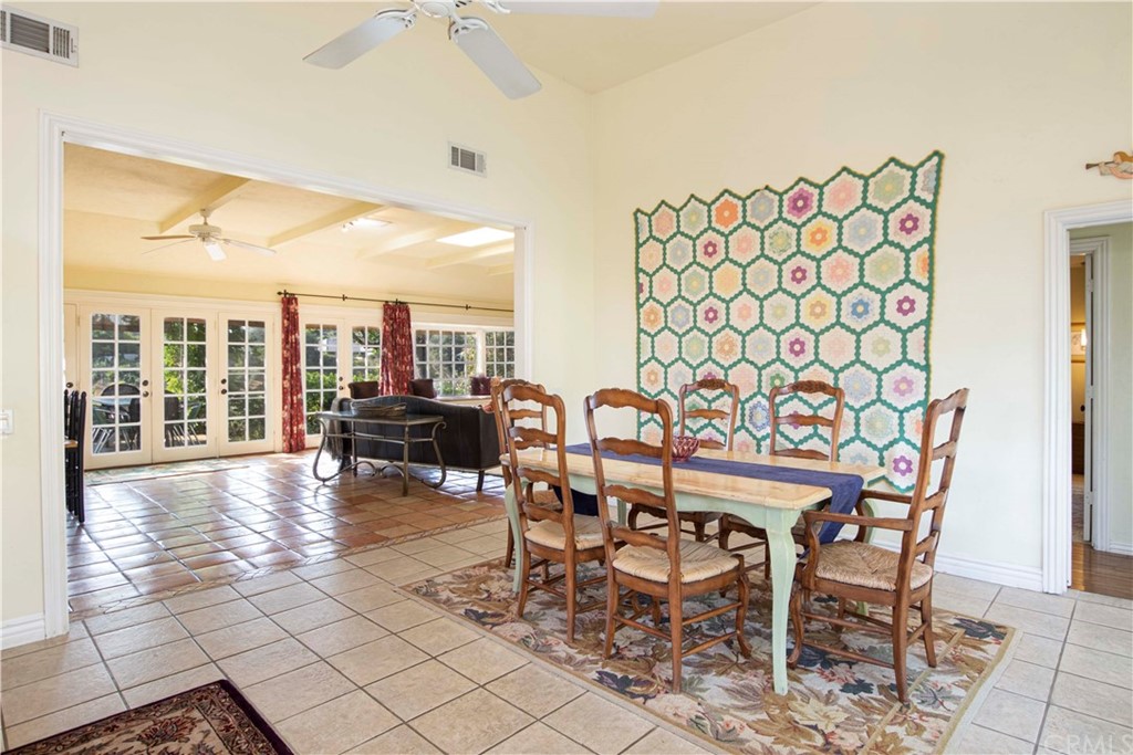 2915 Lakemont Drive Fallbrook, CA 92028 - Photo 12 of 56 a dining room with furniture and a floor to ceiling window