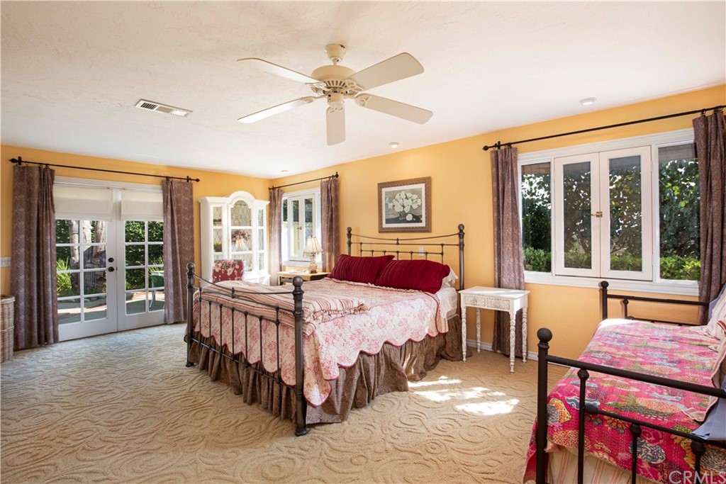 2915 Lakemont Drive Fallbrook, CA 92028 - Photo 19 of 56 a bedroom with a bed and a table