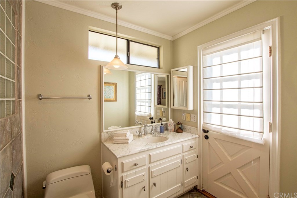 2915 Lakemont Drive Fallbrook, CA 92028 - Photo 29 of 56 a bathroom with a sink a toilet and a window