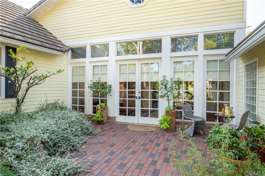 2915 Lakemont Drive Fallbrook, CA 92028 - Photo 3 of 56 a front view of a house with a yard and potted plants