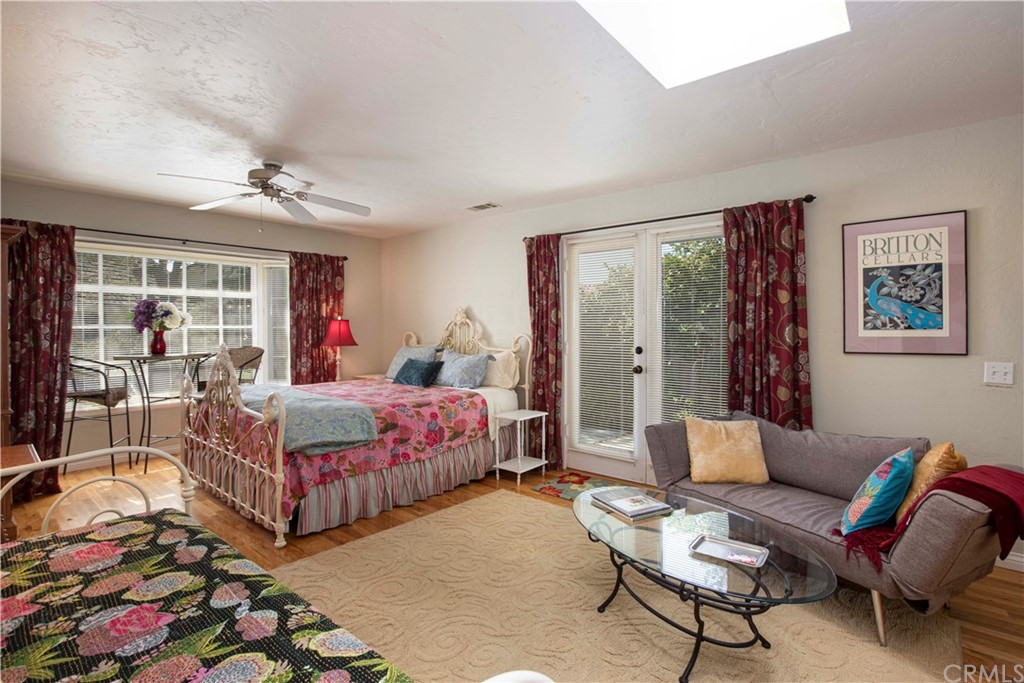 2915 Lakemont Drive Fallbrook, CA 92028 - Photo 31 of 56 a bedroom with a bed and wooden floor