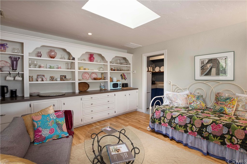 2915 Lakemont Drive Fallbrook, CA 92028 - Photo 32 of 56 a bedroom with furniture and a book shelf