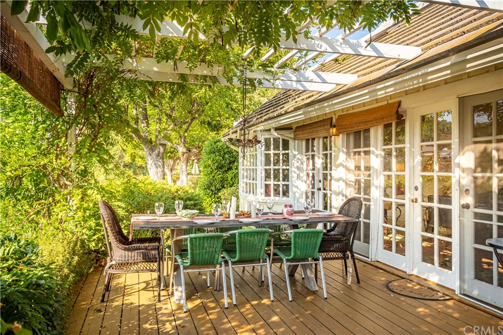 2915 Lakemont Drive Fallbrook, CA 92028 - Photo 42 of 56 a patio with glass top table and chairs