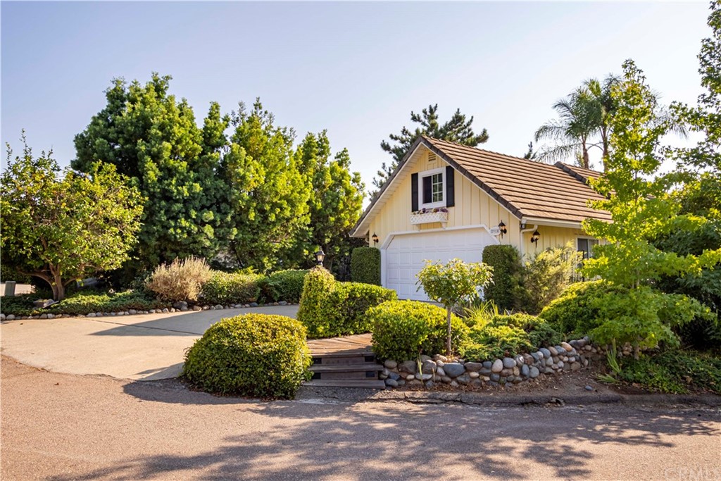 2915 Lakemont Drive Fallbrook, CA 92028 - Photo 5 of 56 a front view of a house with a yard and potted plants