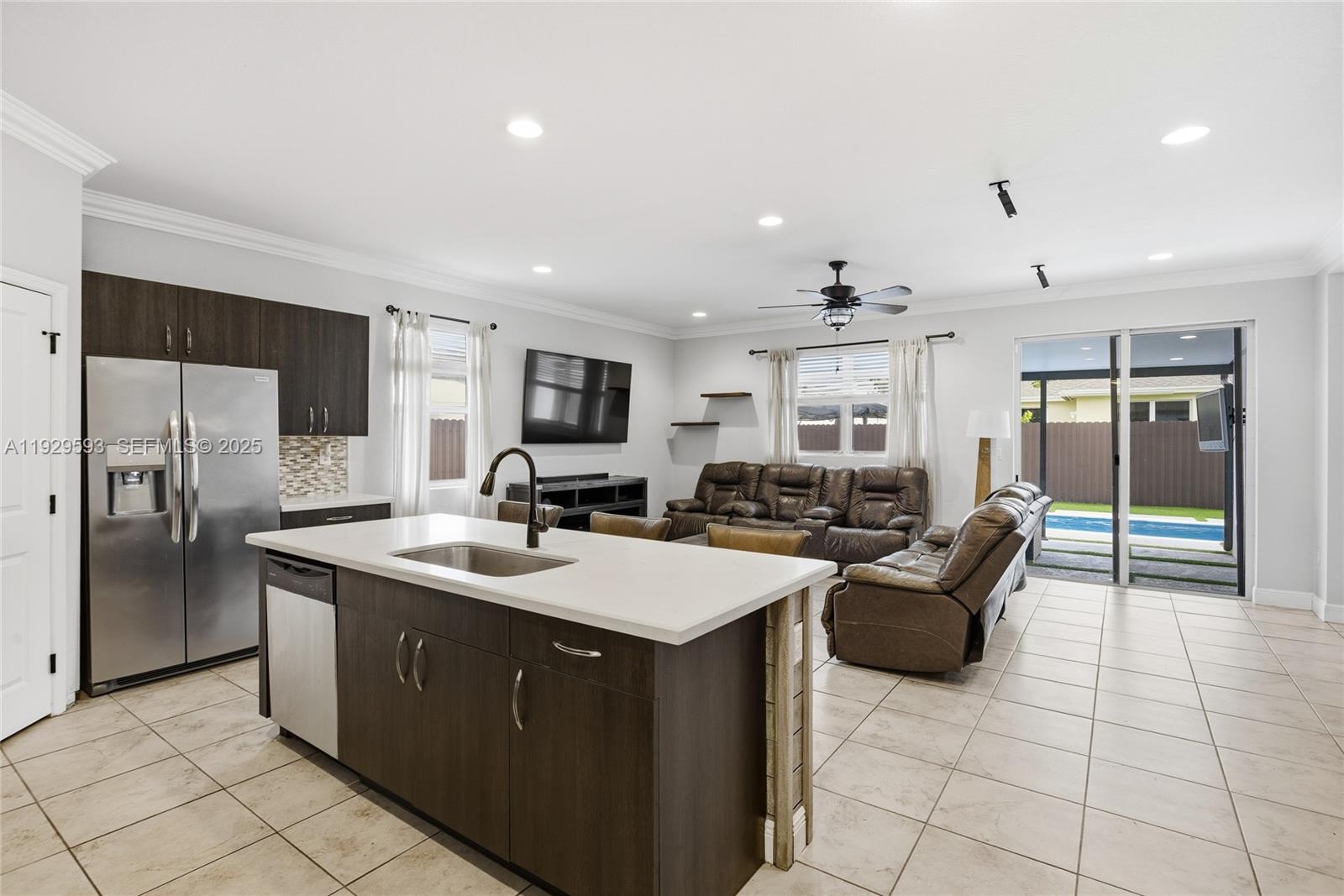 27641 Southwest 134th Court Homestead, FL 33033 - Photo 13 of 40 a kitchen with a sink stainless steel appliances and cabinets