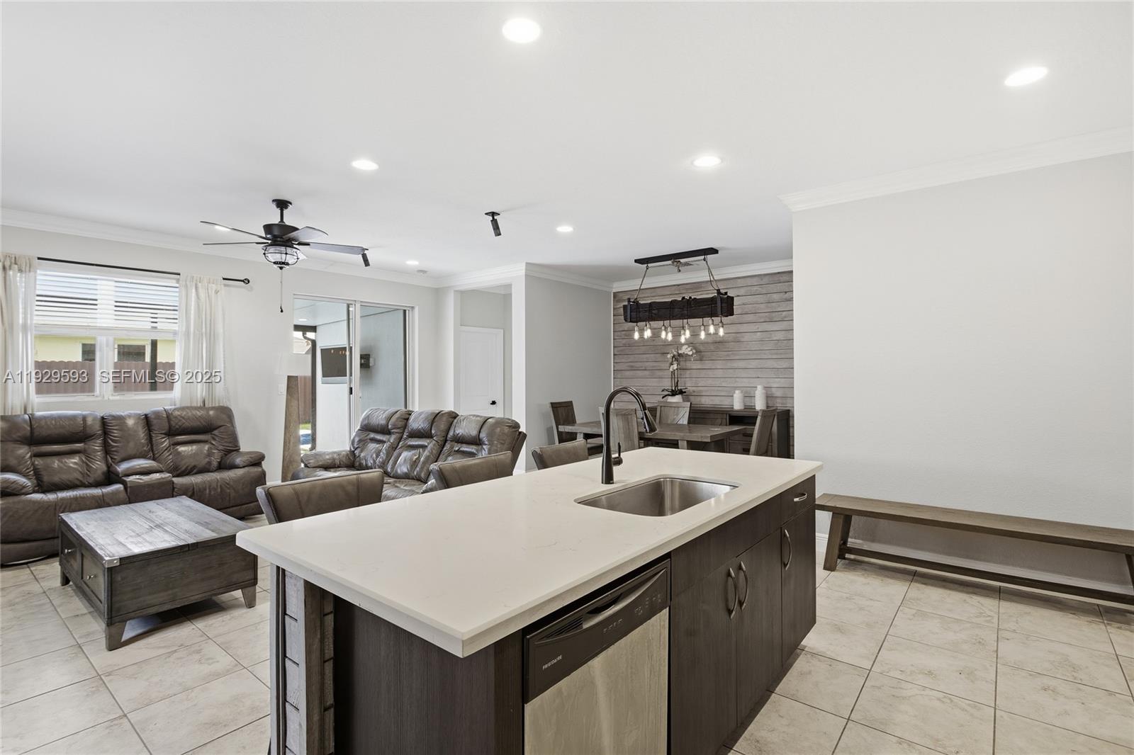 27641 Southwest 134th Court Homestead, FL 33033 - Photo 15 of 40 a large white kitchen with a sink and dishwasher