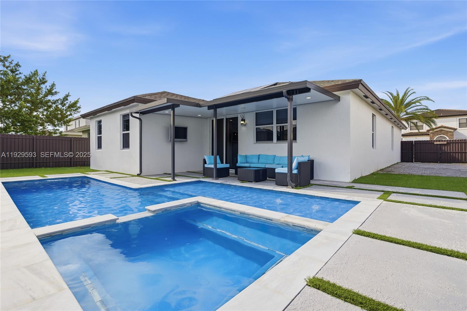27641 Southwest 134th Court Homestead, FL 33033 - Photo 2 of 40 a front view of a house with yard